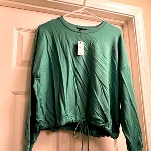 Long sleeve banded bottom sweatshirt. NWT.